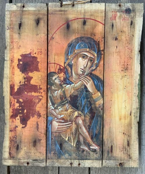 A painting of jesus and mary on wood.