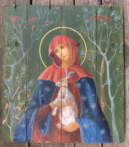 A painting of mary holding baby jesus in her arms.