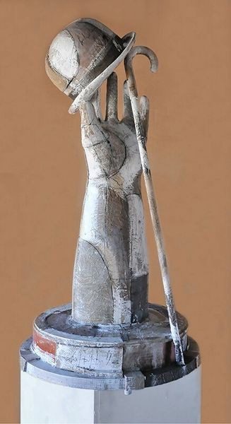 A statue of a hand holding a cane.