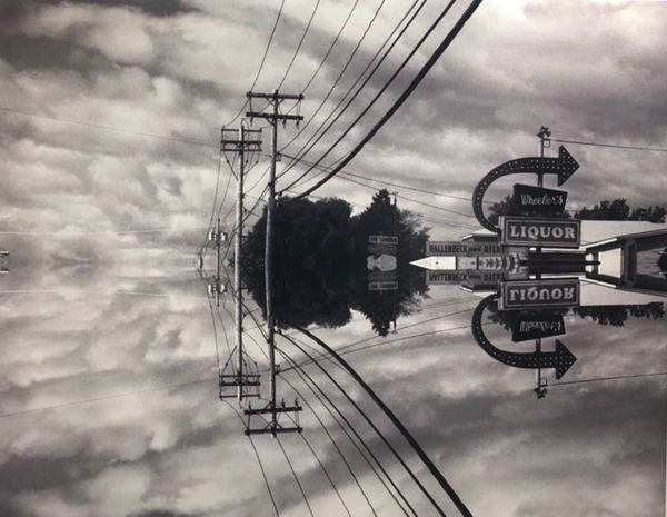 A black and white photo of power lines