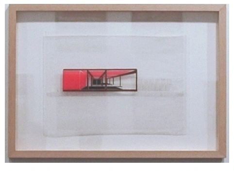 A red and white picture in a wooden frame