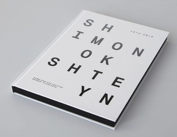 A book with the name of simon and his eye chart.