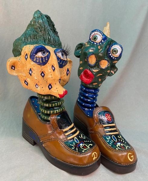 A pair of shoes with faces on them