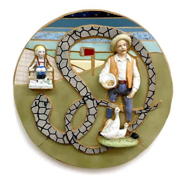 A plate with a man and woman on it