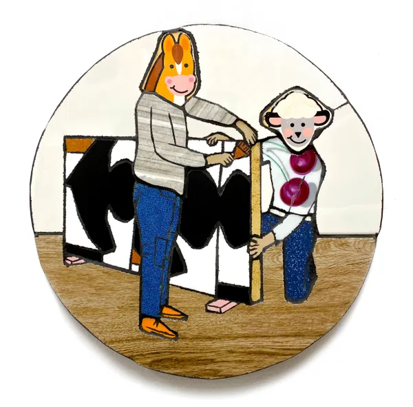 A woman and child are holding a cow.