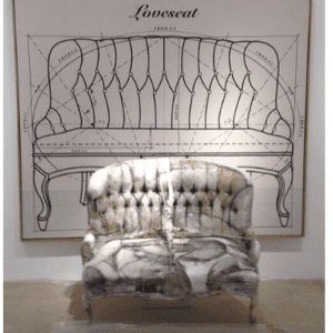 A chair in front of a drawing of a couch.
